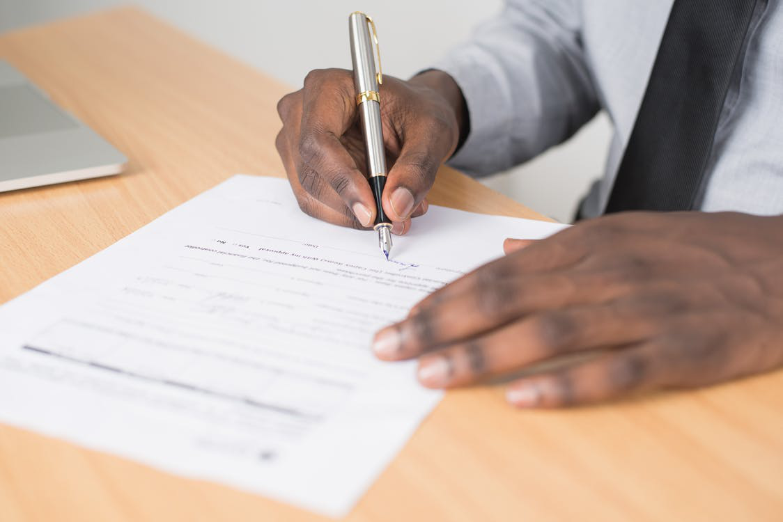 A man filling up a form
