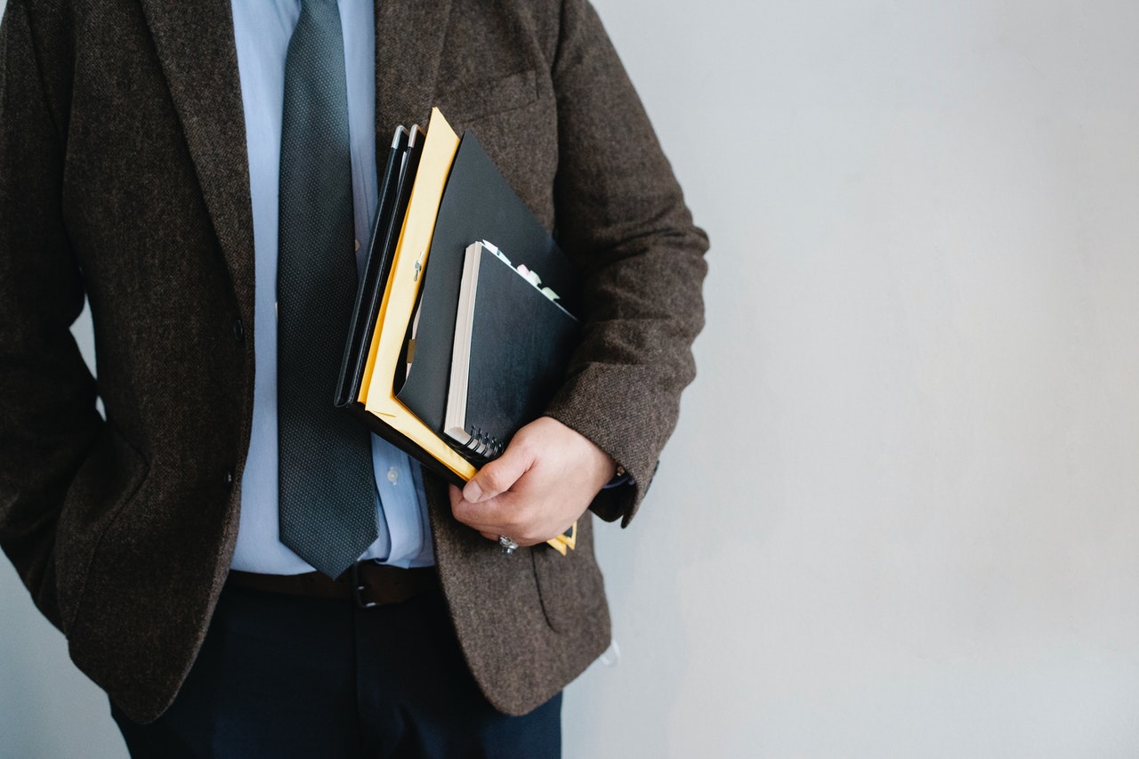 A disability lawyer in Canada holding files