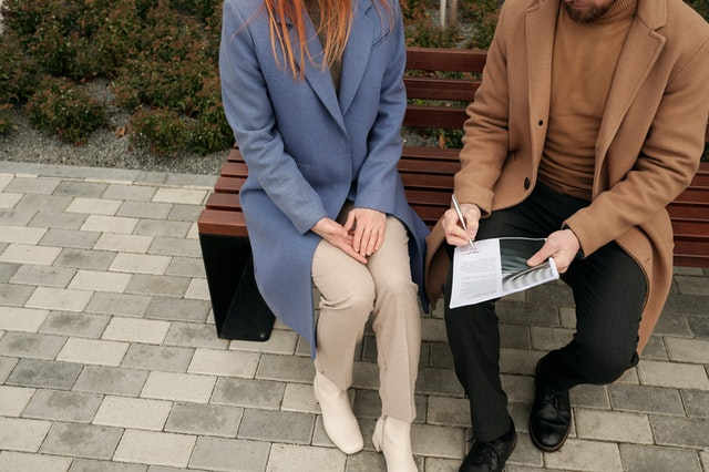 A couple filling details in a spouse sponsorship form