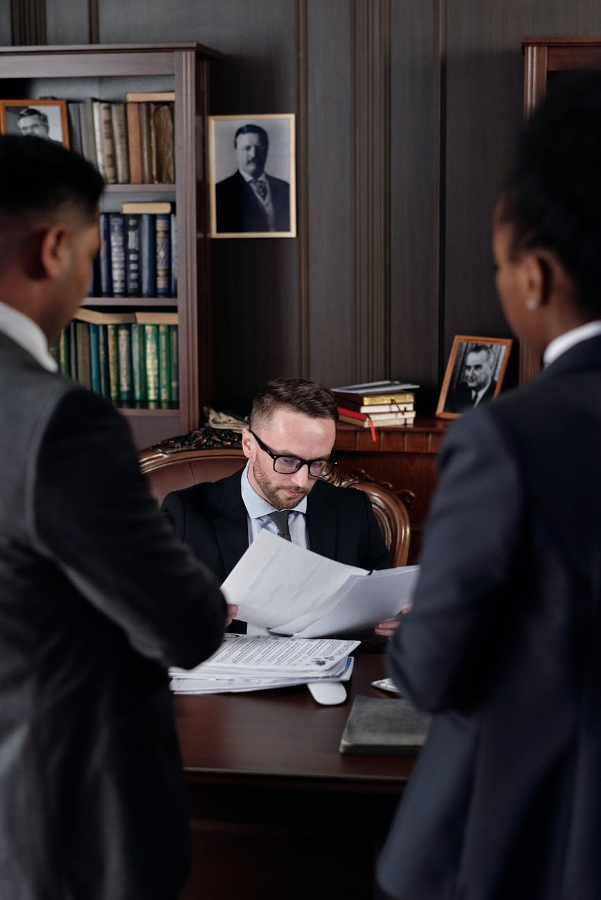 Nanda & Associate Lawyers Canada - A Civil litigation lawyer reviewing property documents