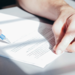Nanda & Associate Lawyers Canada - A person filling the application form