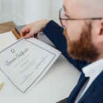 Nanda & Associate Lawyers Canada - A person signing divorce paper