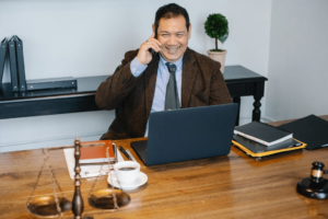 A legal representative in an office talking to a client