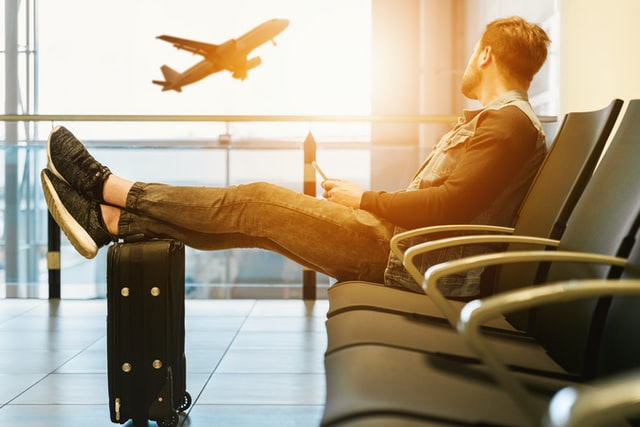 Nanda & Associate Lawyers Canada - A person sitting at an airport