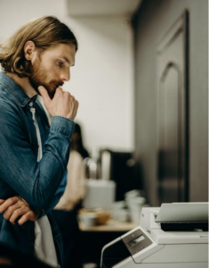 A man using a photocopier machine