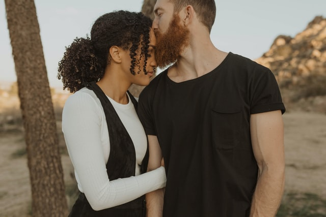 Nanda & Associate Lawyers Canada - A man kissing a woman’s forehead