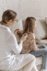  A doctor performing a check up on a child