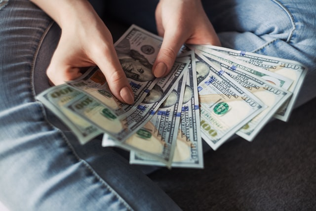 Nanda & Associate Lawyers Canada - A person counting cash