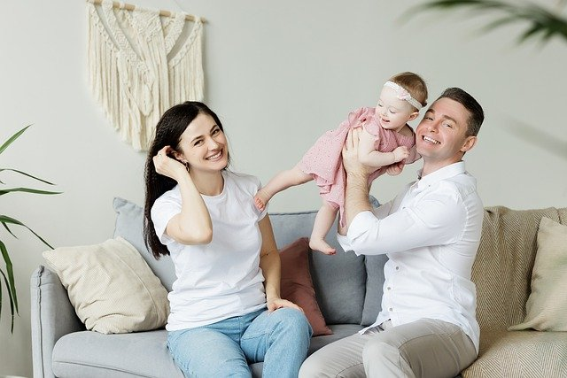  Parents playing with their daughter
