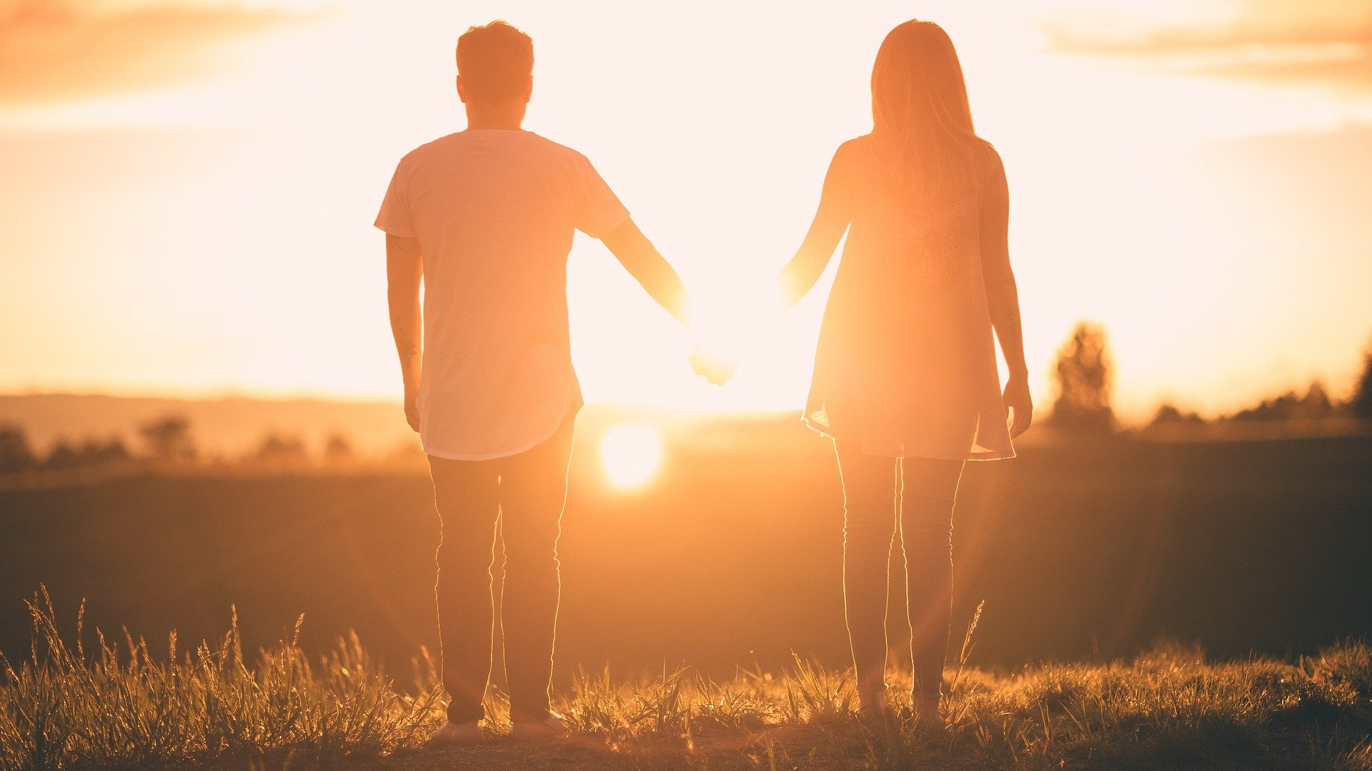 Nanda & Associate Lawyers Canada - Couple holding hands watching the sunset