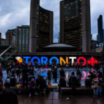 Nanda & Associate Lawyers Canada - people gathered in front of Toronto freestanding signage