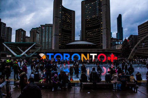 Nanda & Associate Lawyers Canada - people gathered in front of Toronto freestanding signage