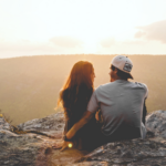Nanda & Associate Lawyers Canada - Man with arm around woman outdoors, overlooking the hills
