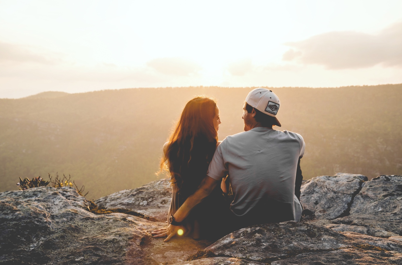 Nanda & Associate Lawyers Canada - Man with arm around woman outdoors, overlooking the hills