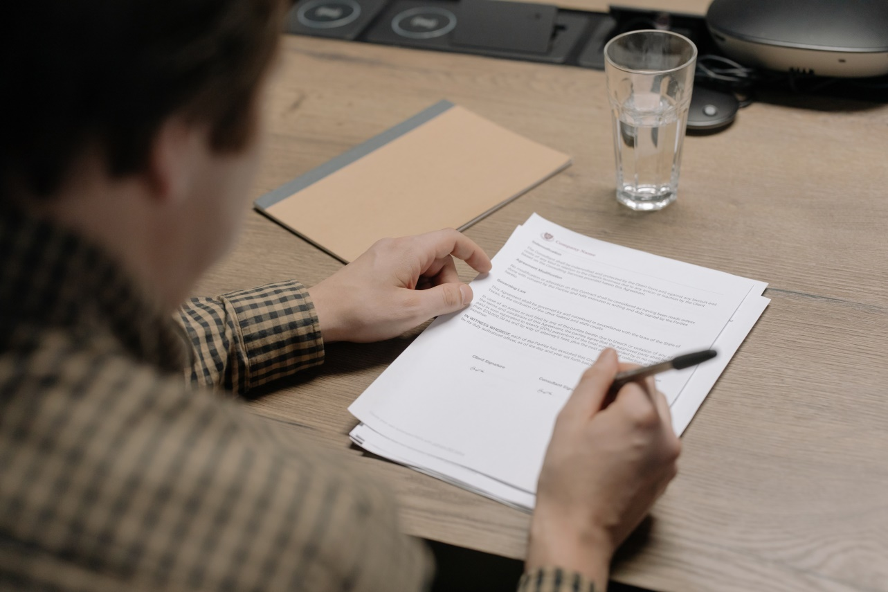 Man signing a contract