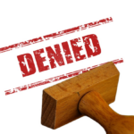 Nanda & Associate Lawyers Canada - Red ‘denied’ stamp with wooden stamper