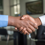 Nanda & Associate Lawyers Canada - a corporate handshake