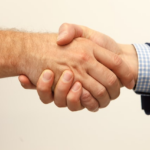 Nanda & Associate Lawyers Canada - An individual shaking hands with a lawyer