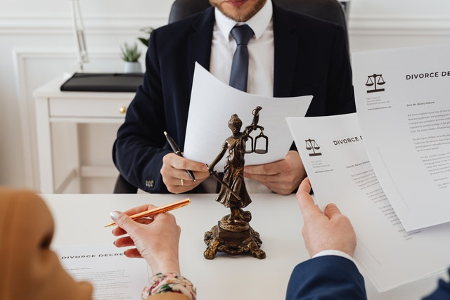 Nanda & Associate Lawyers Canada - A divorce lawyer finalizing joint divorce paperwork