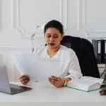 Nanda & Associate Lawyers Canada - A woman in her office looking at legal documents