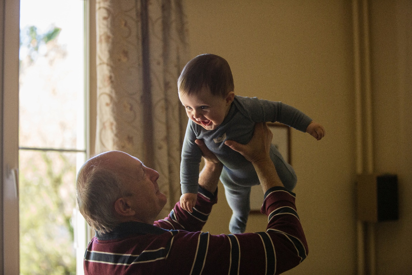Nanda & Associate Lawyers Canada - A grandparent playing with a kid.