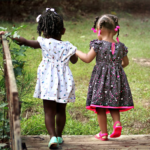 Nanda & Associate Lawyers Canada - girls walking on a brown bridge during daytime
