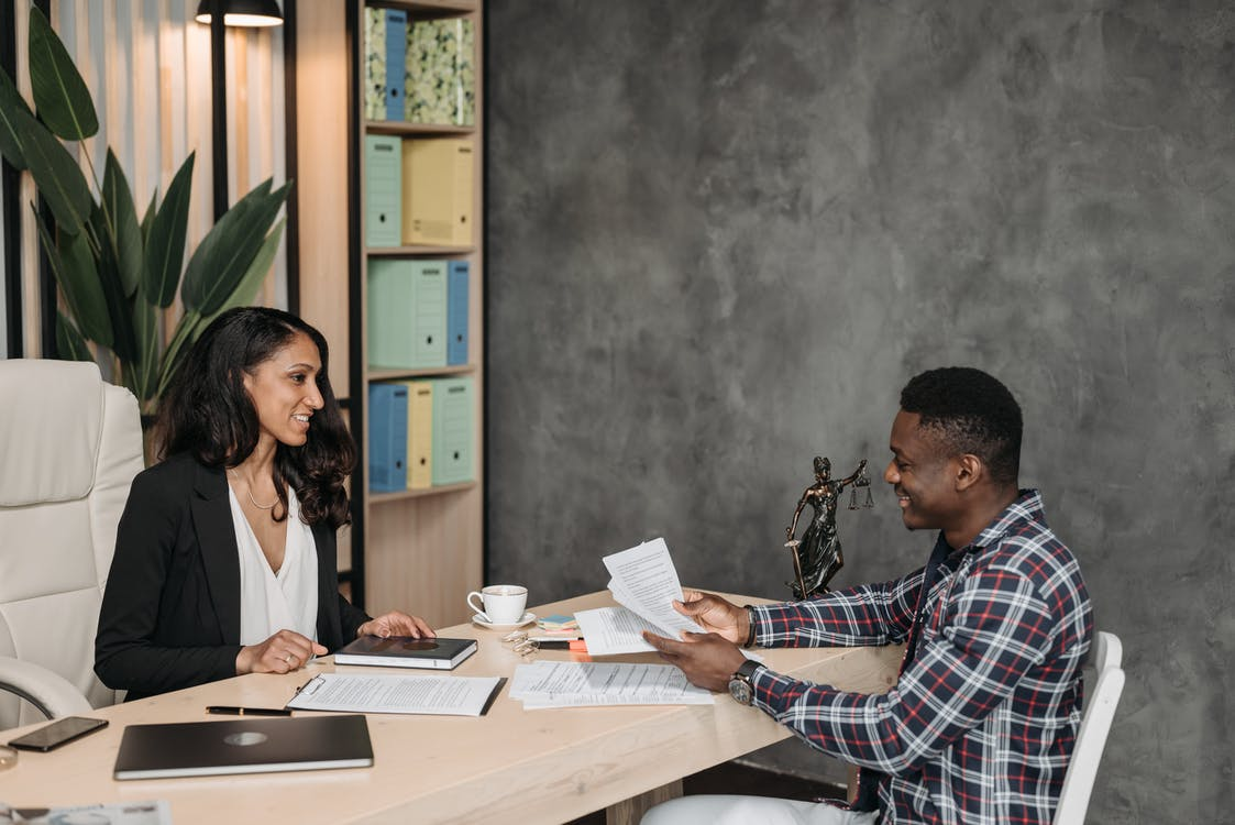 A personal injury lawyer explaining the procedure to a client 