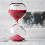 Nanda & Associate Lawyers Canada - A hourglass place on a newspaper