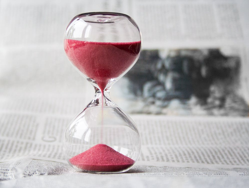 Nanda & Associate Lawyers Canada - A hourglass place on a newspaper