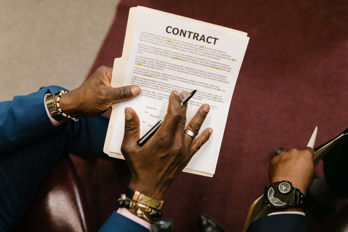 A real estate lawyer explaining leasing clauses to a client