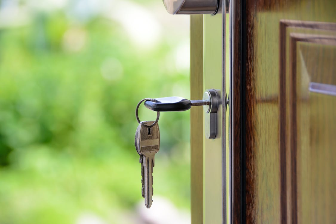 Nanda & Associate Lawyers Canada - A key inserted in a door.