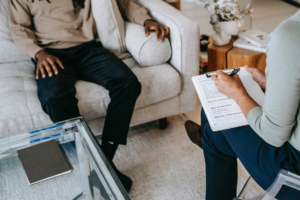 A person noting down complains by a tenant. 