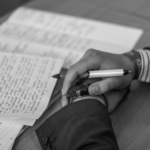 Nanda & Associate Lawyers Canada - Black and white image of a man with handwritten documents