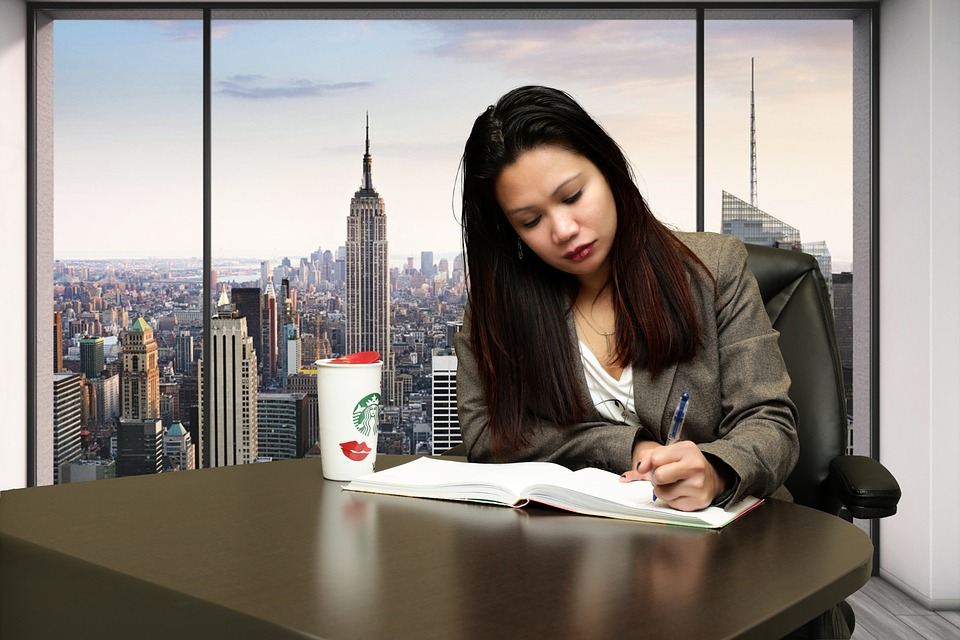 Nanda & Associate Lawyers Canada - woman working with documents in an office