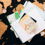 Nanda & Associate Lawyers Canada - A world map with a notebook and a passport