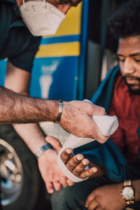 An injured man getting medical aid