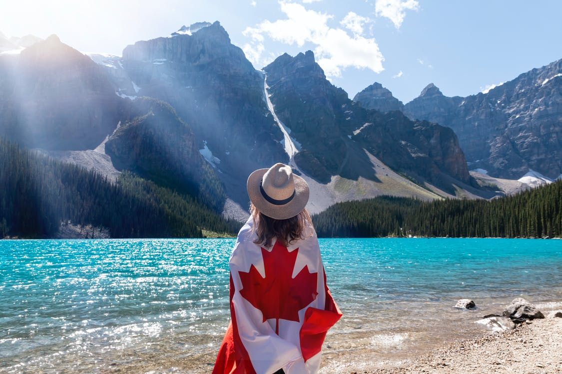 Nanda & Associate Lawyers Canada - A person with a Canadian flag