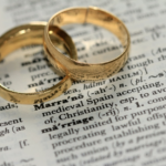 Nanda & Associate Lawyers Canada - Two rings on a book.