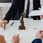 Nanda & Associate Lawyers Canada - A lawyer handing in some papers