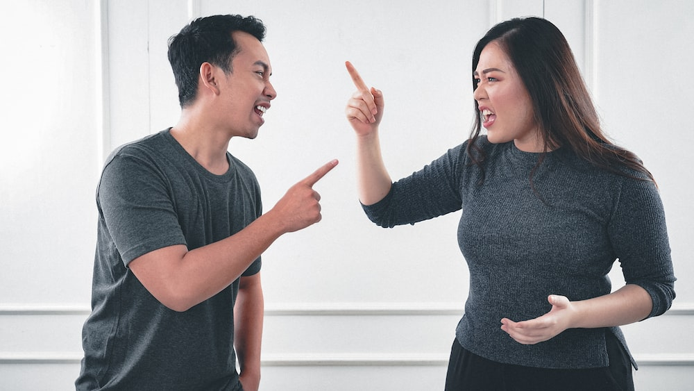 A divorcing couple arguing
