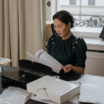 Nanda & Associate Lawyers Canada - a lawyer studying a personal injury case carefully at her desk with files