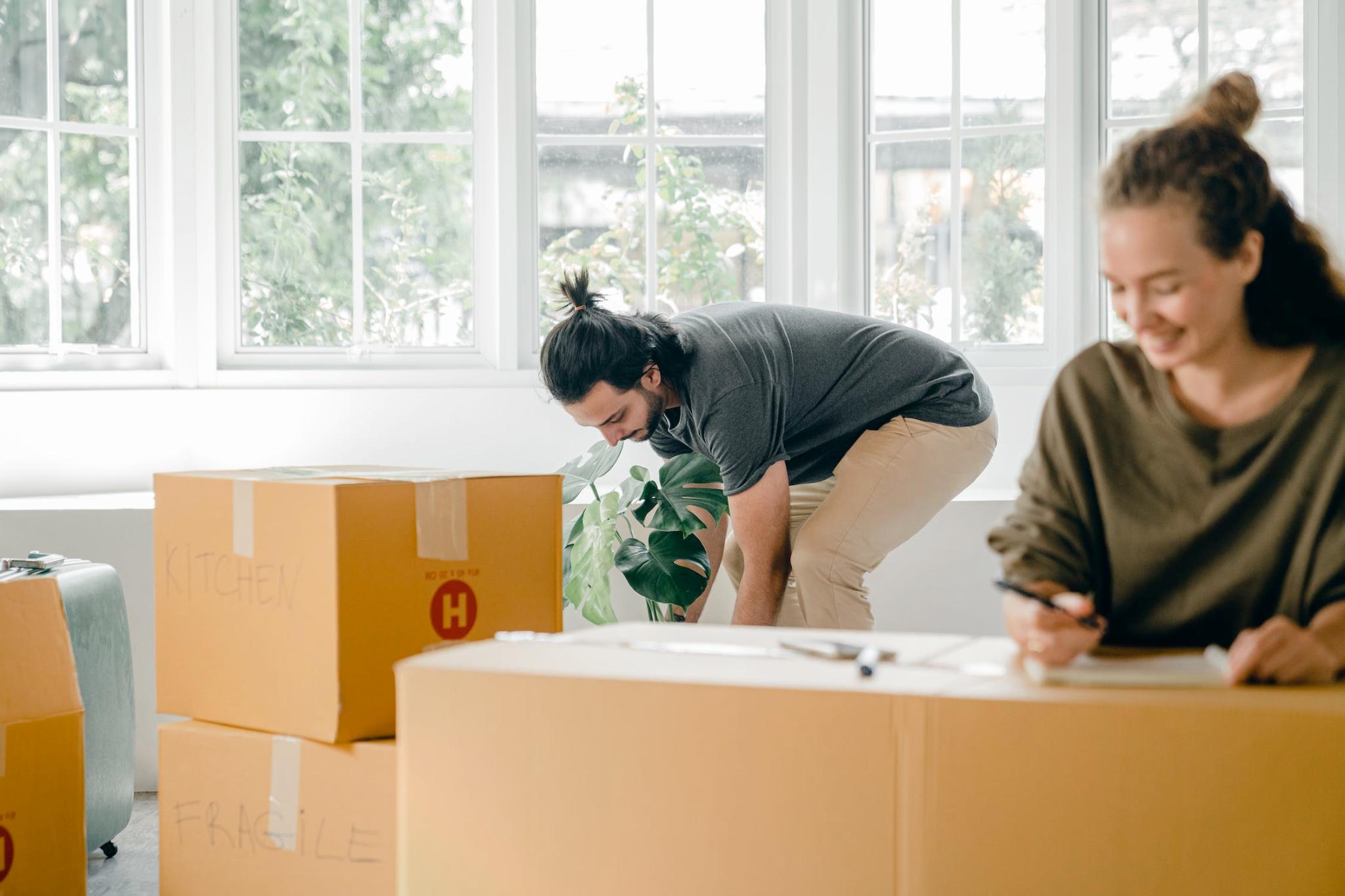 Nanda & Associate Lawyers Canada - An image of a couple unpacking boxes at home
