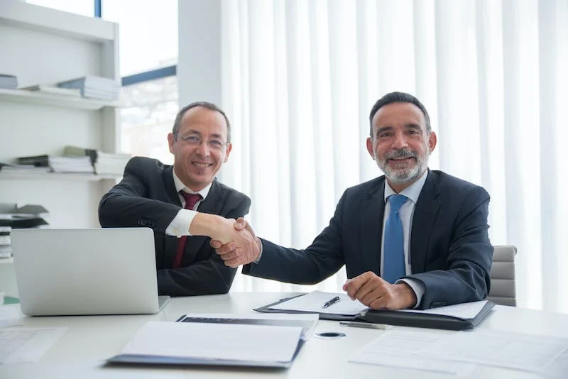 Nanda & Associate Lawyers Canada - lawyers shaking hands in Canada