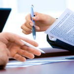 Nanda & Associate Lawyers Canada - A person about to sign a document