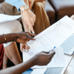 Nanda & Associate Lawyers Canada - An image of a woman pointing at a contract