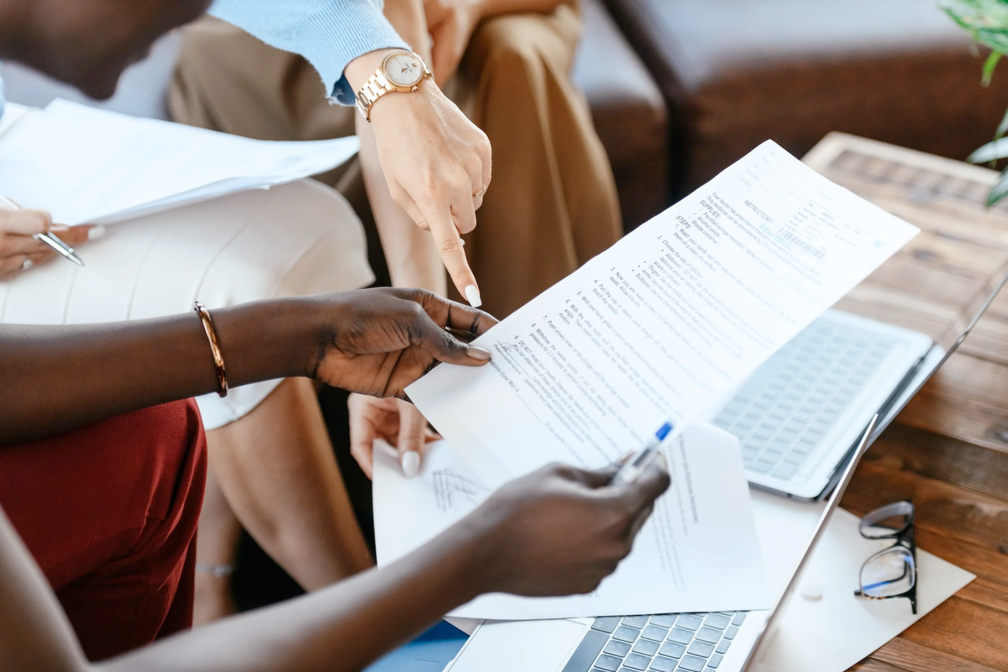 Nanda & Associate Lawyers Canada - An image of a woman pointing at a contract