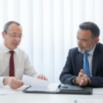 Nanda & Associate Lawyers Canada - An image of two people discussing a contract