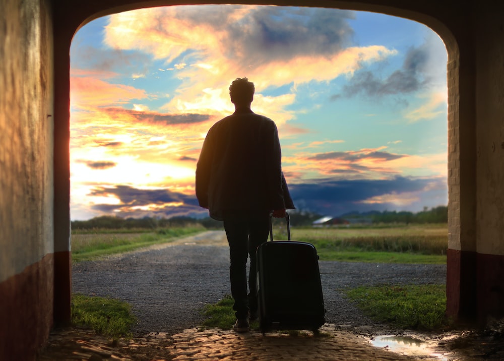 Nanda & Associate Lawyers Canada - A person walking out with luggage
