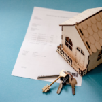 Nanda & Associate Lawyers Canada - Rental document with a miniature wooden house and keys.