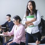 Nanda & Associate Lawyers Canada - A smiling student standing in the classroom